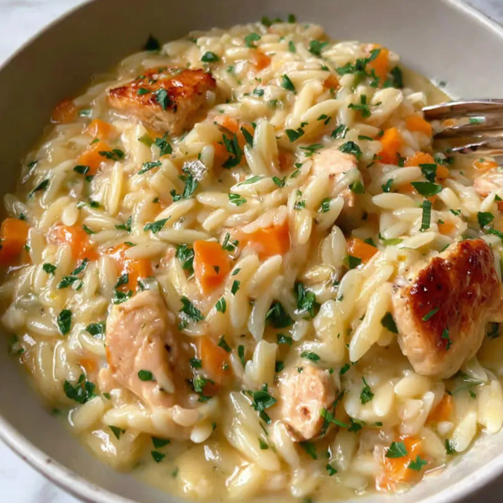 A bowl of creamy chicken pot pie orzo.