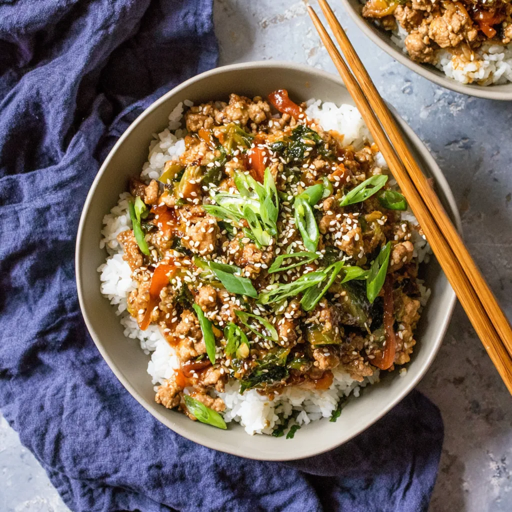 Teriyaki turkey rice bowl with ground turkey, sweet teriyaki sauce, white rice, green onions, and sesame seeds